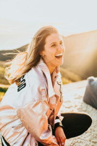 Woman on a hike smiling with straight white teeth in Broomfield, CO
